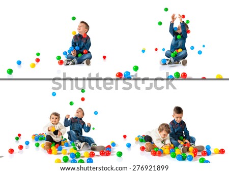 Set images of brothers playing with colored balls