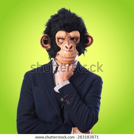 Monkey man thinking over colorful background