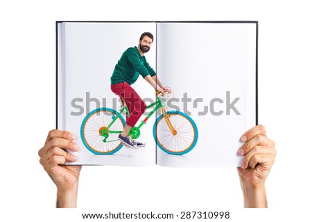 man on bike printed on book