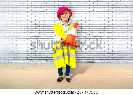 Blonde little girl dressed like workman