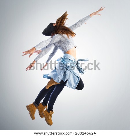 Double exposition girl jumping in hip hop style