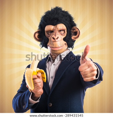 Monkey man eating a banana over pop background