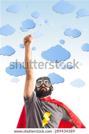 Superhero doing fly gesture over clouds background