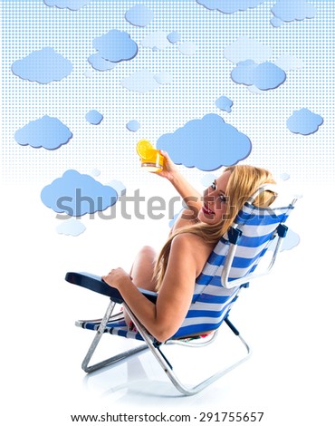 Young woman in bikini holding a cocktail over clouds background