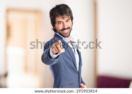 Businessman pointing to the front inside house