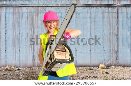 Worker woman with chainsaw