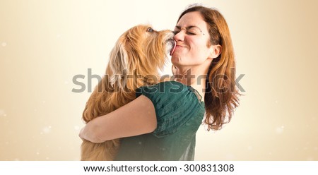 Dog kissing her owner