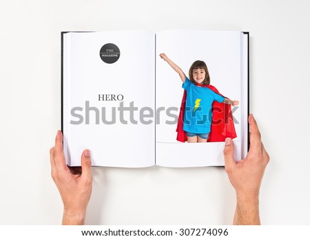 Girl dressed like superhero  printed on book