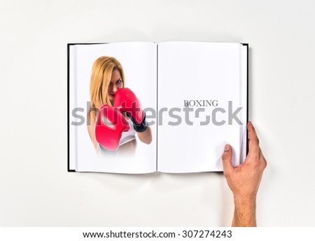 Blonde girl with boxing gloves printed on book