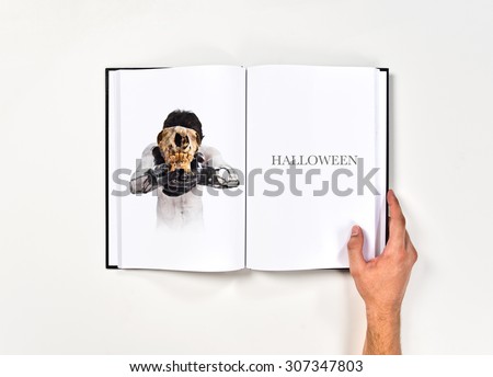 Primitive man offering a rabbit skull printed on book