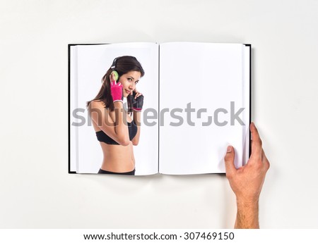 woman listening music printed on book