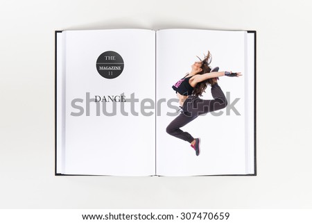 Teenager girl jumping in hip hop style printed on book
