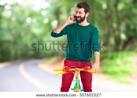 Man on bike on unfocused background