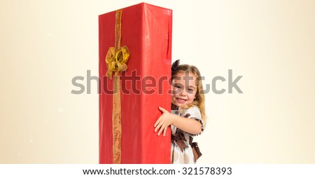 Little blonde girl with big gift