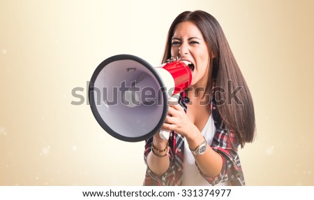 Woman shouting by megaphone