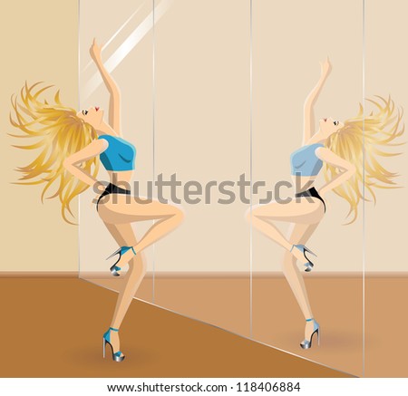 Beautiful blonde woman dancing  in front of the mirror in gym classroom. Dancer in dance studio.