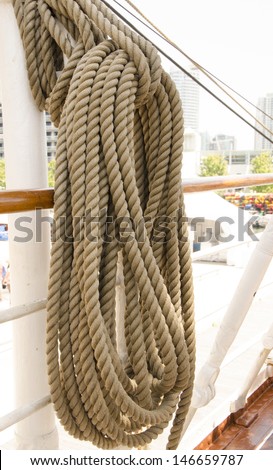 Ropes neatly hung on a ship deck