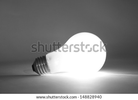 A lit light bulb not in socket
