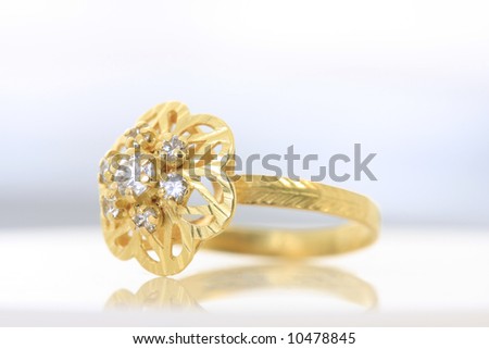 Unique handmade golden ring with rubies - white background