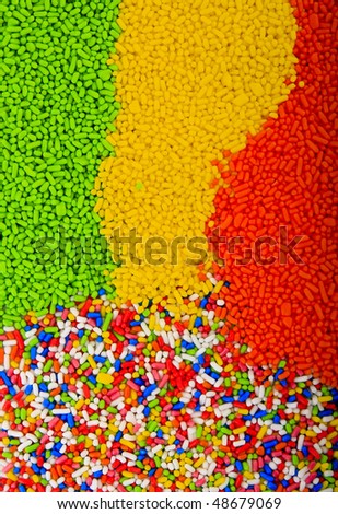 Background of colorful sprinkles, jimmies for cake decoration or ice cream topping