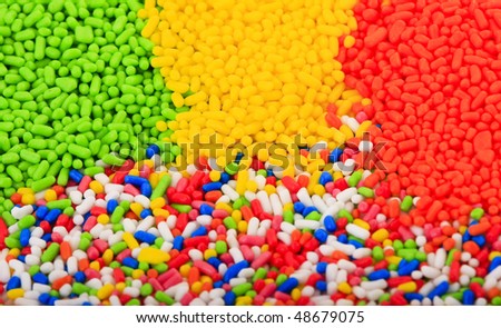 Background of colorful sprinkles, jimmies for cake decoration or ice cream topping