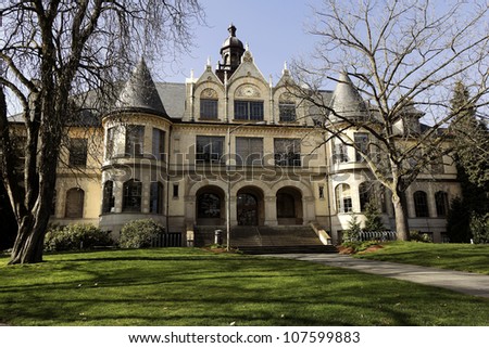 A castle like structure called Danny hall with a clock located at the university of Washington, Seattle, Washington, USA
