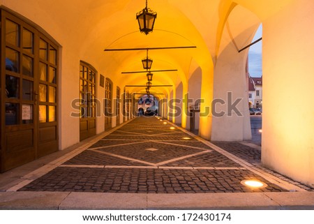 Illuminated Arcades of a medieval building, in the old city center of Sibiu.