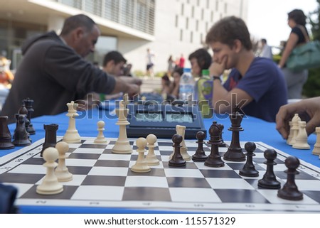 THESSALONIKI,GREECE - OCT,07:Unidentified players take part in chess tournament marathon of 30 rounds for beginners and experienced chess players on October 07, 2012 in Thessaloniki, Greece.