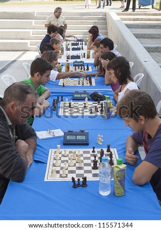 THESSALONIKI,GREECE - OCT,07:Unidentified players take part in chess tournament marathon of 30 rounds for beginners and experienced chess players on October 07, 2012 in Thessaloniki, Greece.