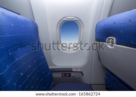 Airplane seat and window inside an aircraft..shal low DOF