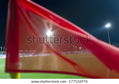 CHANIA, GREECE - FEB 2 : Stadium lights through the red corner flag during the Greek Superleague game Platanias vs Paok on February 2, 2014.