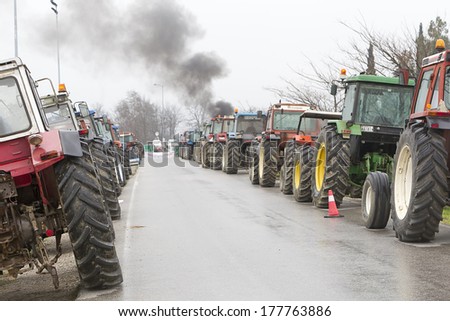 VERIA, GREECE - FEBRUARY 6 2014: Protest by farmers with their tractors on main roads in Veria for fairer tax system