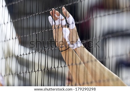 THESSALONIKI GREECE FEBRUARY 15 2014 Hands on net during the Hellenic Volleyball League game Paok vs Olympiacos at PAOK Sports Arena Shallow dof THESSALONIKI GREECE FEBRUARY 15 2014 Hands on net during the Hellenic Volleyball League game Paok vs Olympiacos at PAOK Sports Arena Shallow dof