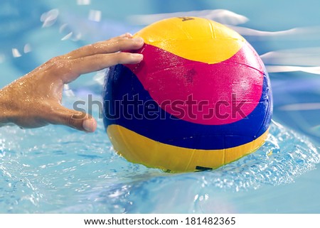 THESSALONIKI, GREECE MAR 5, 2014 : Close-up on a hand holding the water polo ball during the game PAOK vs Nereas on March 5, 2014.