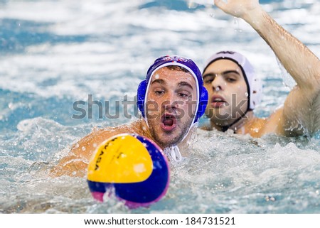 THESSALONIKI, GREECE MAR 22, 2014 : The players of the two teams in action during the Greek League water polo game PAOK vs Vouliagmeni on March 22, 2014.