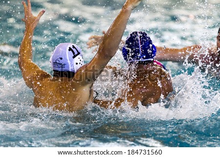 THESSALONIKI, GREECE MAR 22, 2014 : The players of the two teams in action during the Greek League water polo game PAOK vs Vouliagmeni on March 22, 2014.