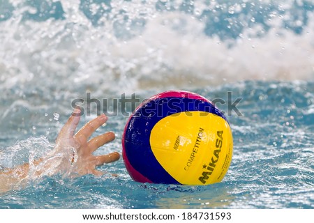 THESSALONIKI, GREECE MAR 22, 2014 : Close-up on a hand holding the water polo ball during the Greek League water polo game PAOK vs Vouliagmeni on March 22, 2014.