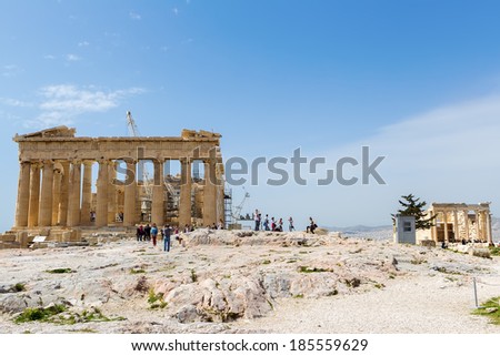 ATHENS, GREECE - MARCH 27 , 2014 : Tourists in famous old city Acropolis Parthenon Temple. Its construction began in 447 BC in the Athenian Empire. It was completed in 438 BC