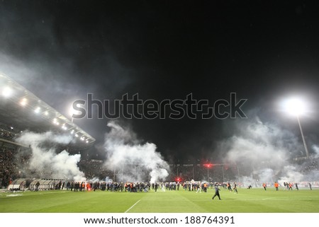 THESSALONIKI, GREECE APRIL 16, 2014 : Police and crowd in the field after the Greek Cup Semi Final match PAOK vs Olympiacos