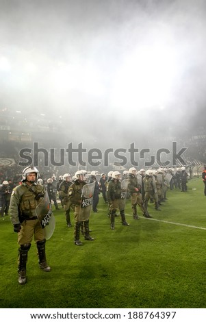 THESSALONIKI, GREECE APRIL 16, 2014 : Police in the field after the Greek Cup Semi Final match PAOK vs Olympiacos