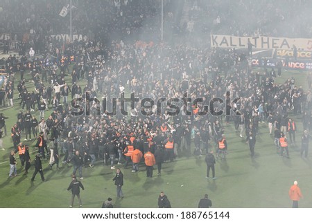 THESSALONIKI, GREECE APRIL 16, 2014 : Big crowd of fans getting in the field after the Greek Cup Semi Final match PAOK vs Olympiacos