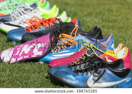 THESSALONIKI, GREECE APRIL 16, 2014 : Football shoes in line during the training before the Greek Cup Semi Final match PAOK vs Olympiacos