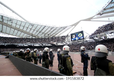 ATHENS, GREECE APRIL 26, 2014 : Police in the field in front of Paok fans during the Greek Cup Final match Paok vs Panathinaikos