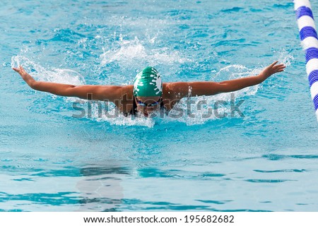 THESSALONIKI, GREECE- MAY 24, 2014: Male and female participants from Balkan countries competing in Makedonian swimming race in Thessaloniki, Greece.