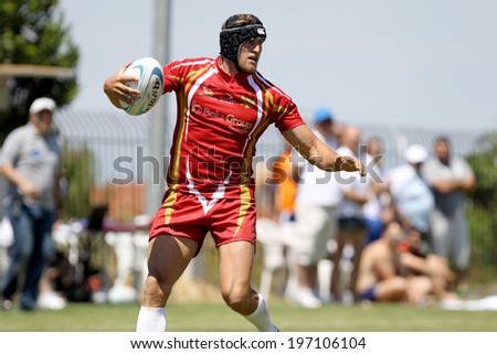 THESSALONIKI, GREECE- MAY 31, 2014: Rugby player holding the ball during the match of Turkey vs Montenegro for the European Championship Rugby, which took place in Thessaloniki, Greece.