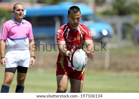 THESSALONIKI, GREECE- MAY 31, 2014: Rugby player holding the ball during the match of Turkey vs Montenegro for the European Championship Rugby, which took place in Thessaloniki, Greece.