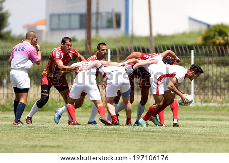 THESSALONIKI, GREECE- MAY 31, 2014: Rugby players pushing in a scrum during the match Turkey vs Montenegro for the European Championship Rugby, which took place in Thessaloniki, Greece.