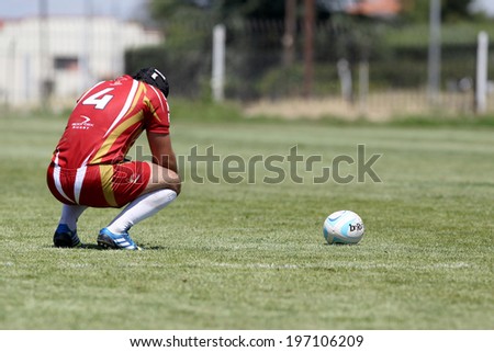 THESSALONIKI, GREECE- MAY 31, 2014: Rugby player with the ball during the match of Turkey vs Montenegro for the European Championship Rugby, which took place in Thessaloniki, Greece.