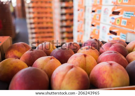 NAOUSSA, GREECE- JULY 10, 2014: Products of Agricultural Cooperative of Naoussa, Greece, stacked in boxes. The famous 