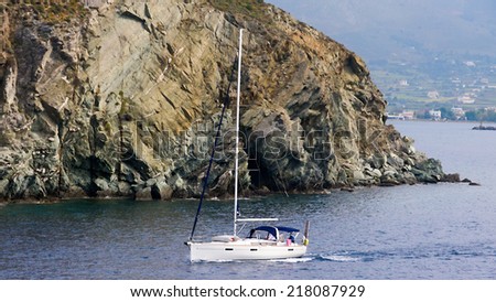 ANDROS, GREECE- APRIL 10, 2014: Yacht near the city at Andros, Greece. The island is located near the geographical center of the Cyclades island complex.